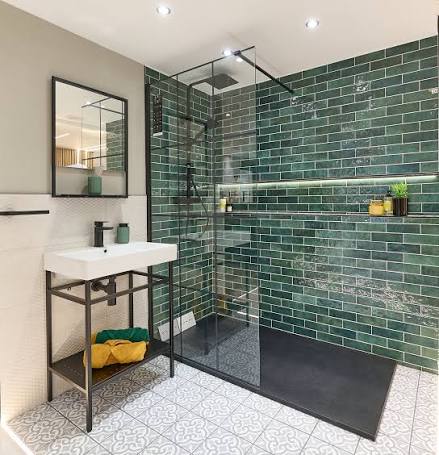 Bathroom renovation with green subway tile and black fixtures