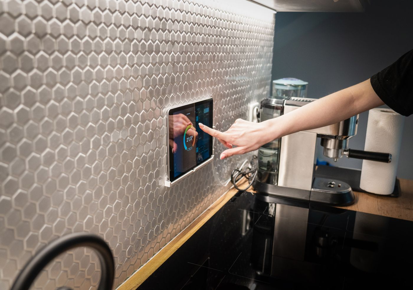 Smart home touchscreen control panel installed in a kitchen